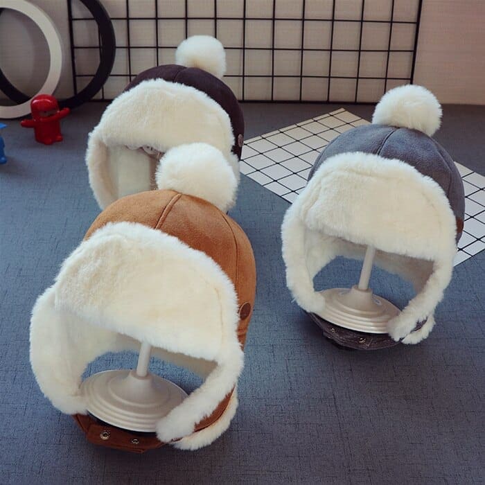 Cagoule bonnet avec protège oreille et pompon